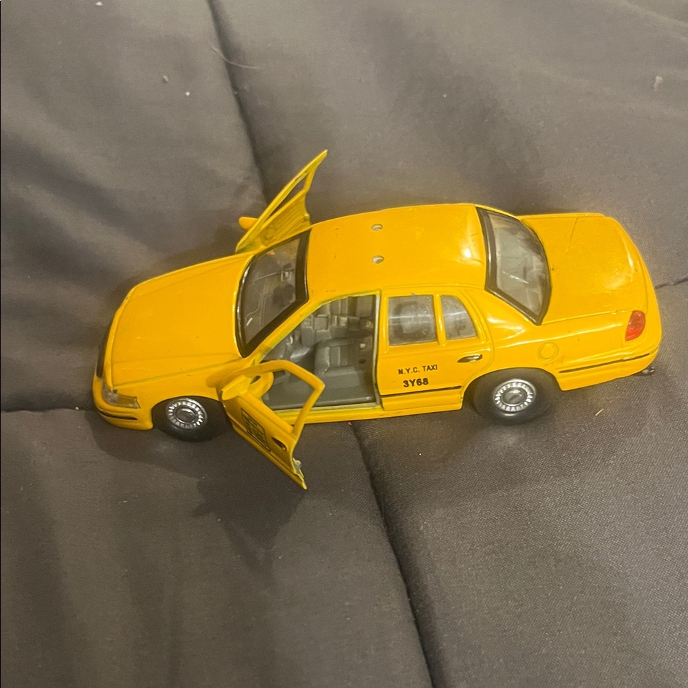 Welly Yellow Toy Taxi Car